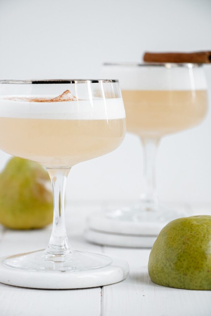 two cinnamon pear gin fizz cocktails