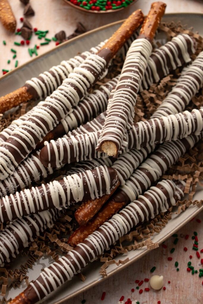 chocolate covered pretzel rods  with sprinkles 