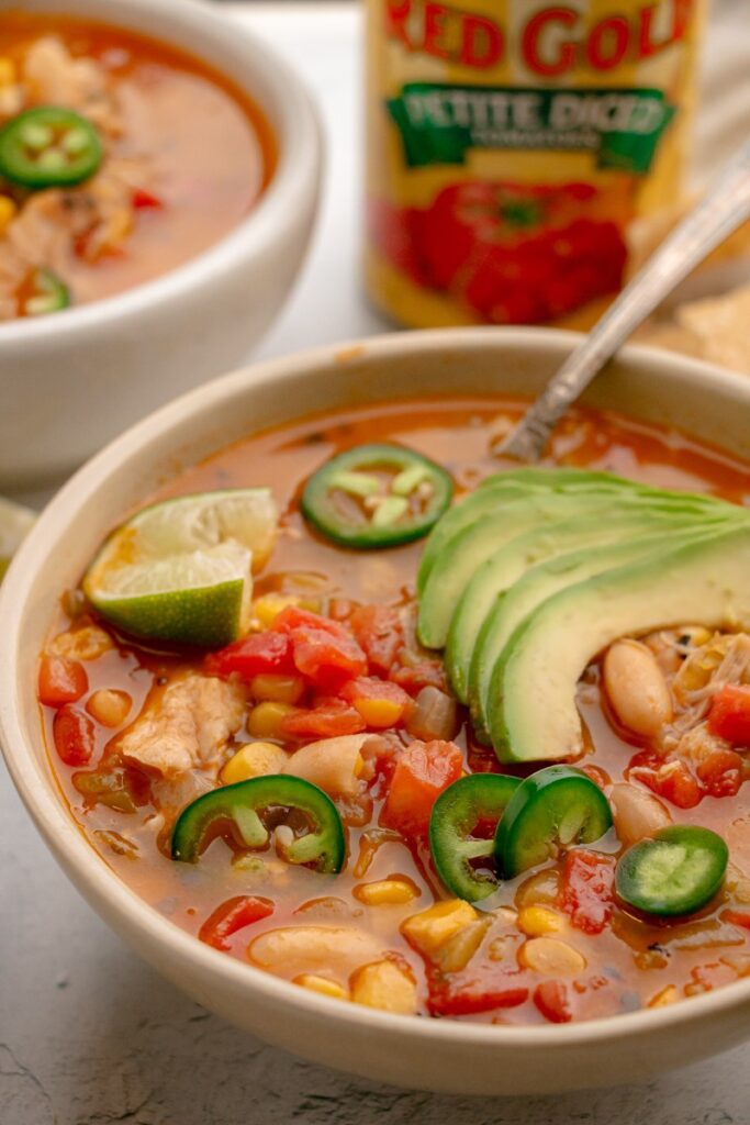 bowl of southwest chicken chili with avocado