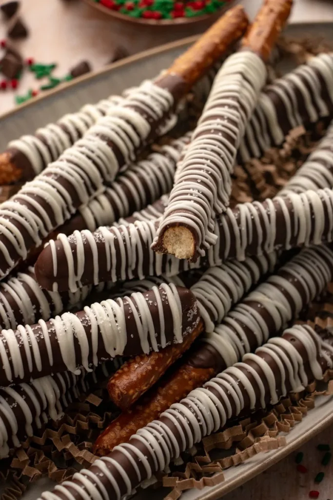 chocolate covered pretzel rods on a plate