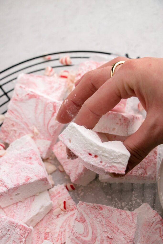 hand grabbing a fluffy homemade marshmallow