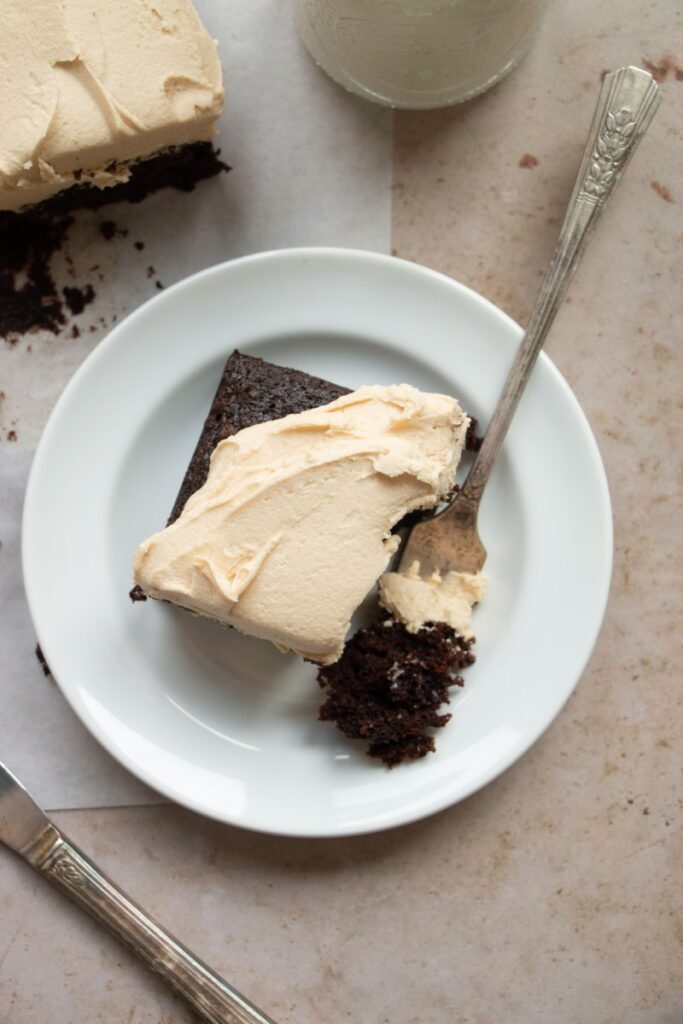 plate with slice chocolate cake with peanut butter frosting