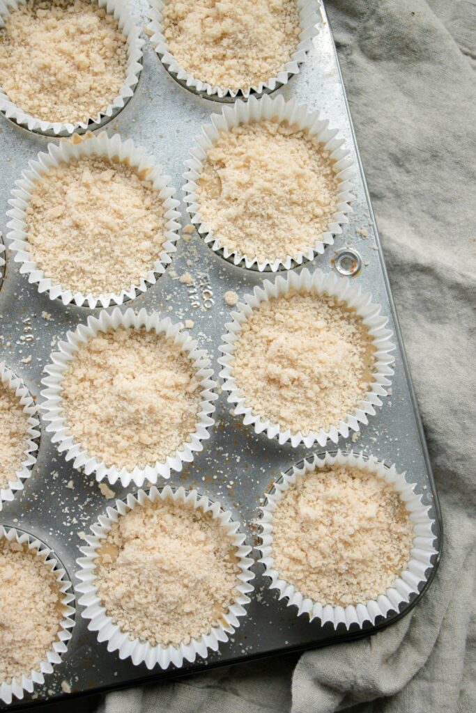 unbaked muffins with streusel topping