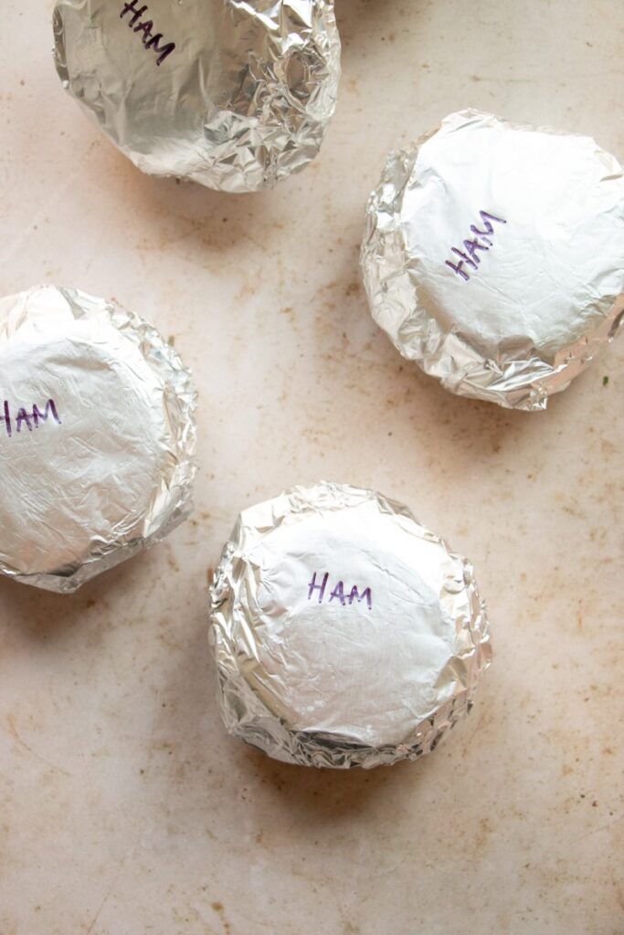 meal prep breakfast sandwiches wrapped in aluminum foil