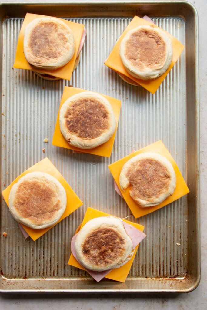 assembled breakfast sandwiches on a sheet pan