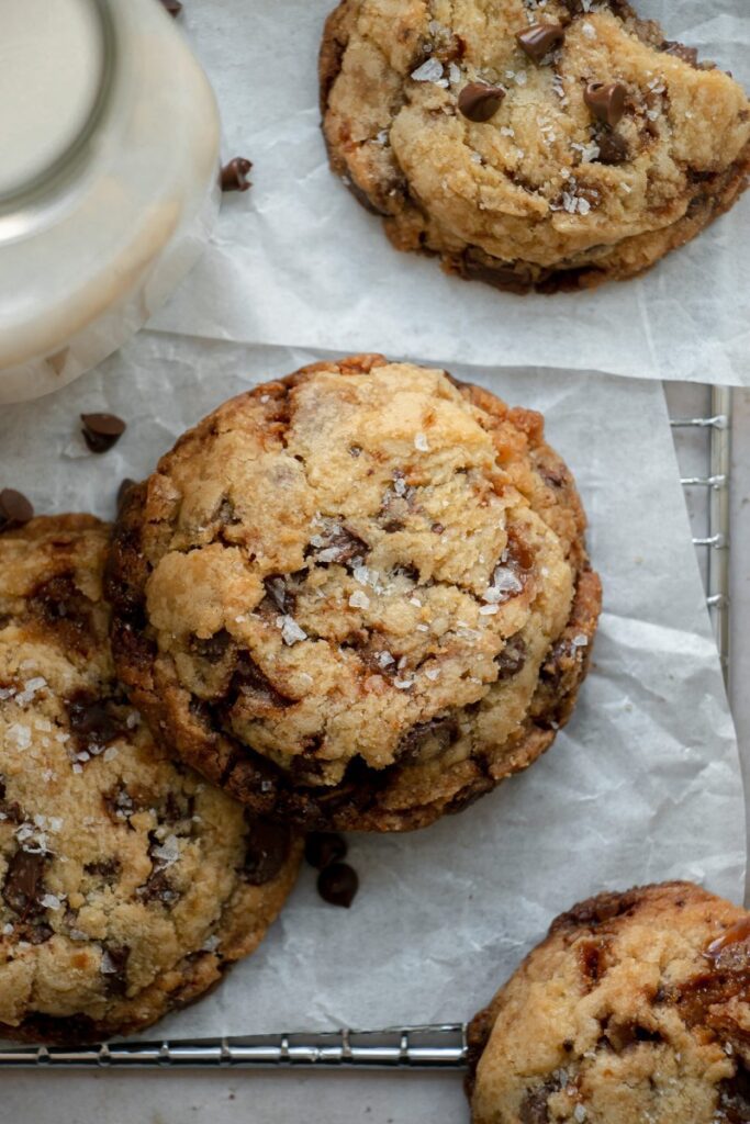 salted toffee chocolate chip cookies on parchment paper