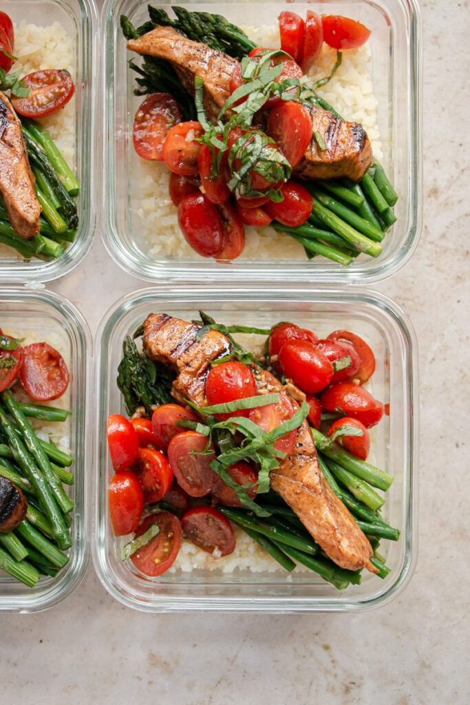 meal prep bruschetta salmon in containers 