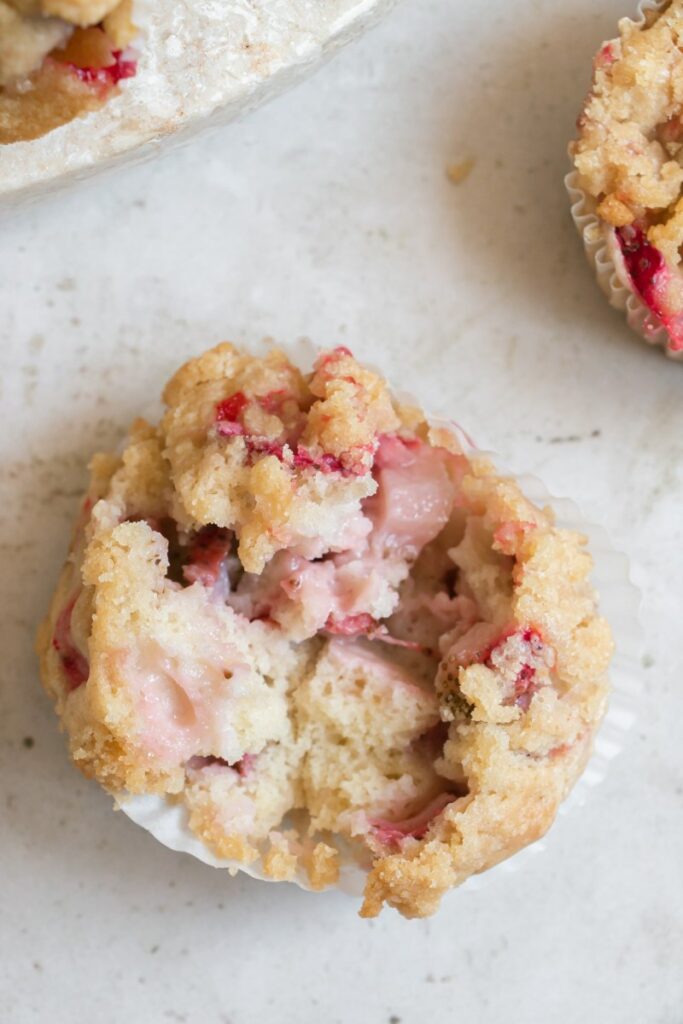 fresh strawberry muffin torn in half