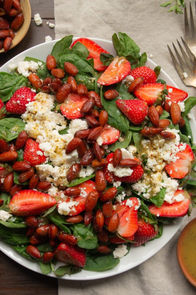 easy strawberry spinach salad topped with citrus poppy seed dressing 