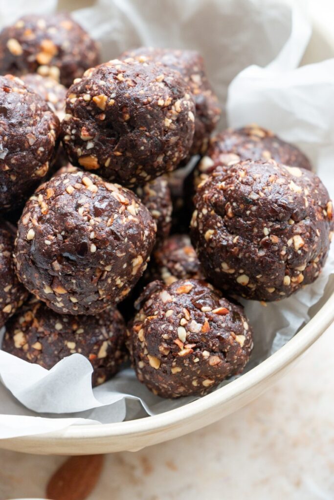 Chocolate Almond Date Bites on parchment paper