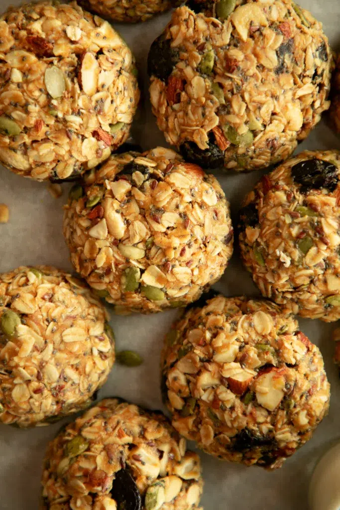 scoops of breakfast cookies with seeds and dried fruits