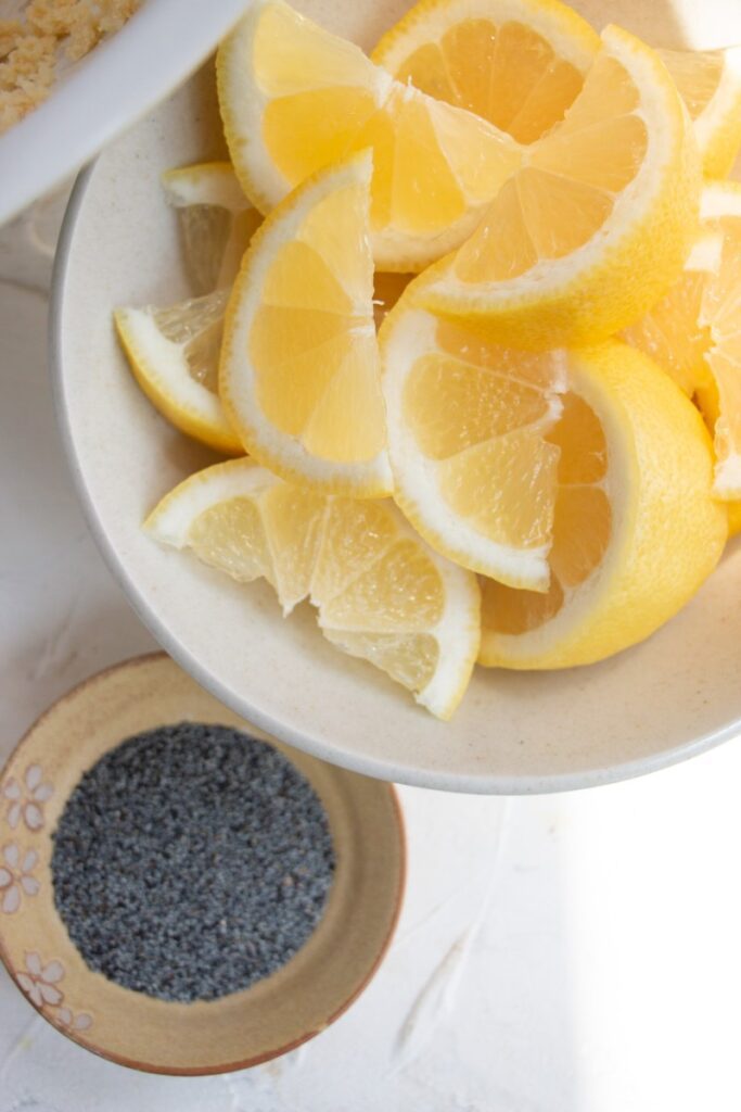 bowls of lemon wedges and poppy seeds