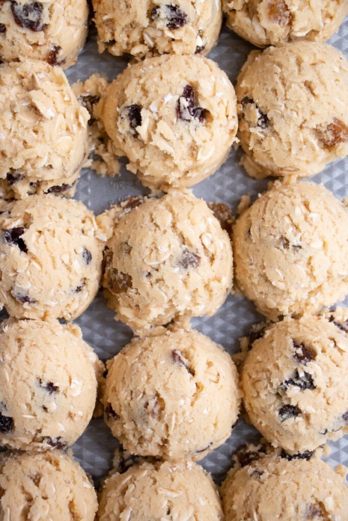 Easy Soft & Chewy Oatmeal Raisin Cookie dough on a baking tray