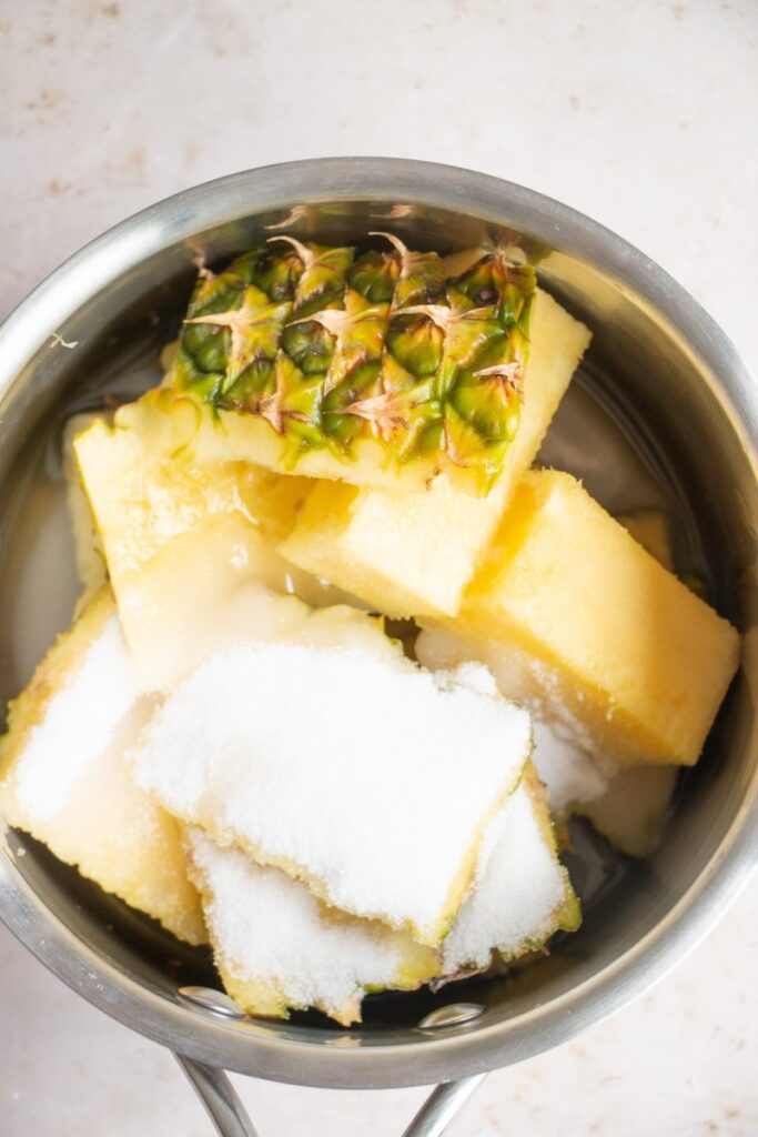 pineapple core and rinds in a saucepan 
