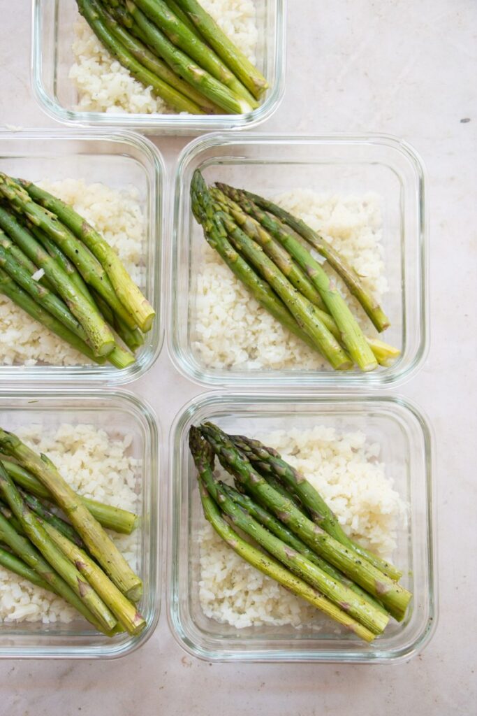 asparagus and cauliflower rice in glass containers 