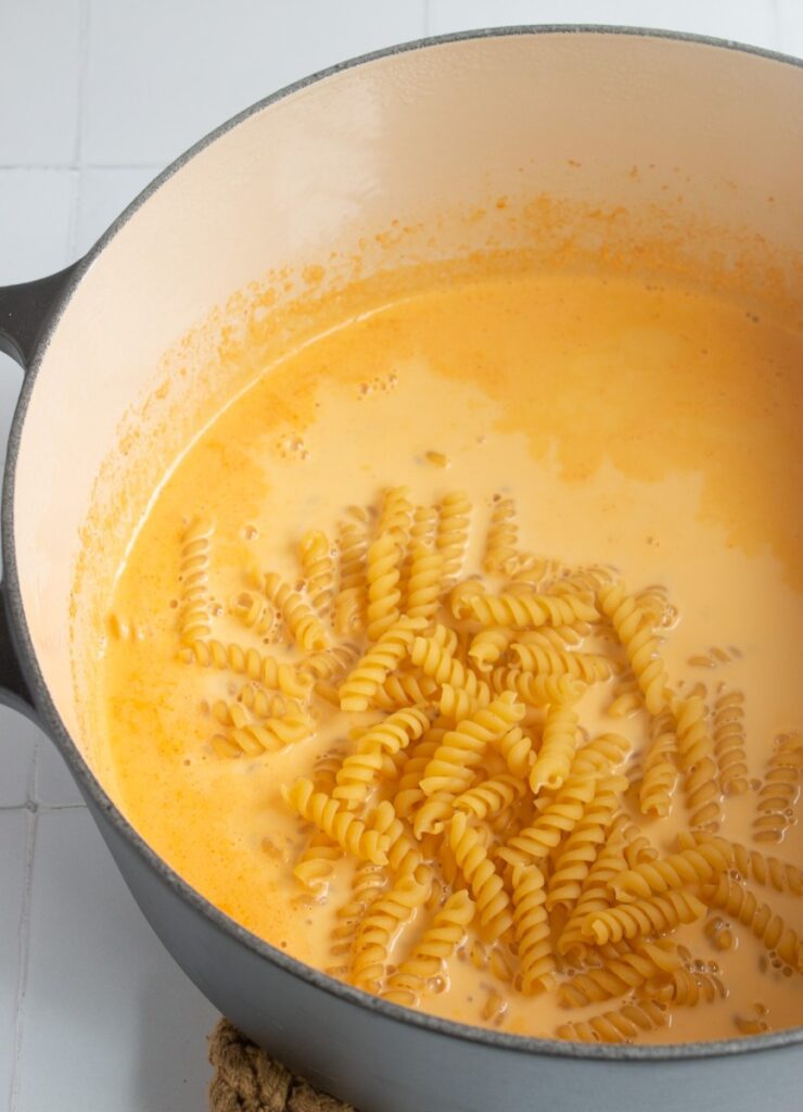 uncooked pasta in  milk mixture 