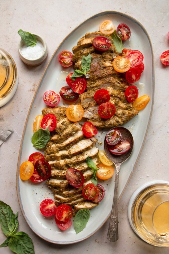 platter with pesto chicken and cherry tomatoes 