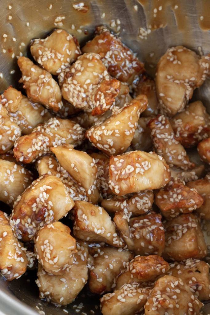 chicken bits tossed in homemade sesame sauce and sesame seeds