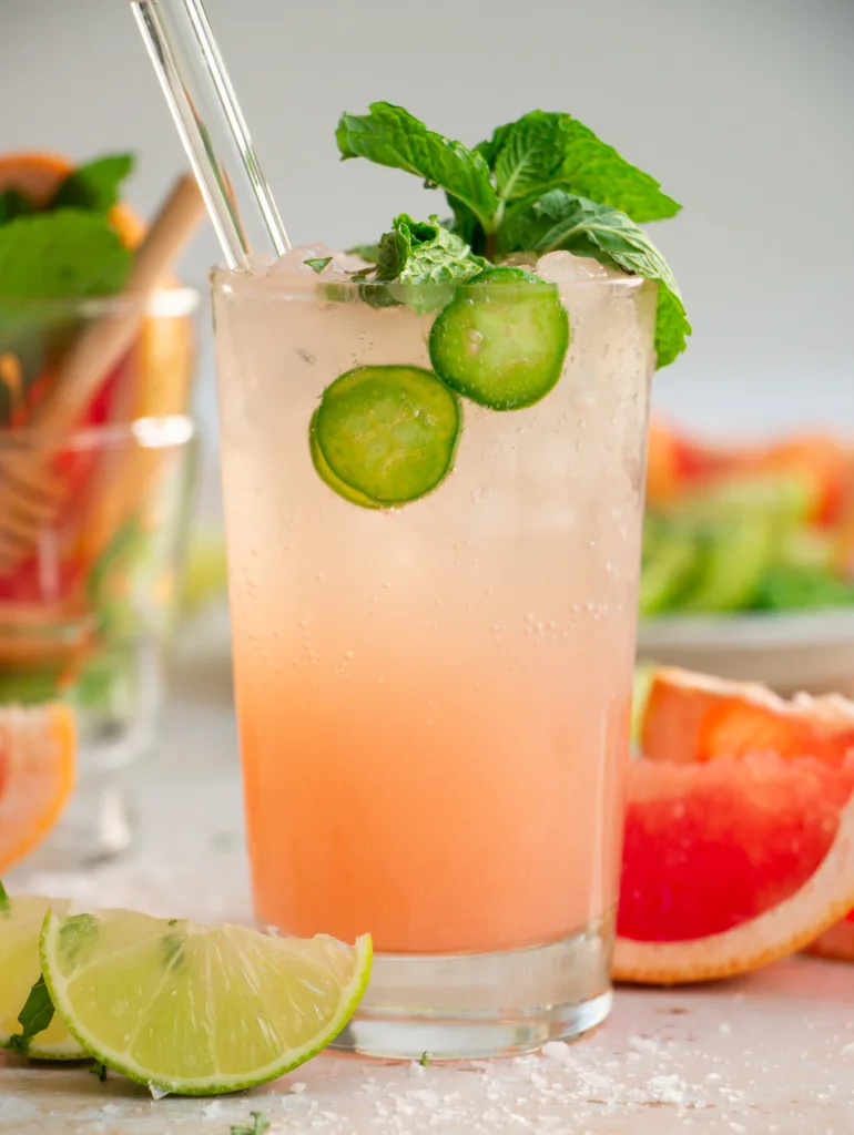 glass with grapefruit paloma and fresh mint