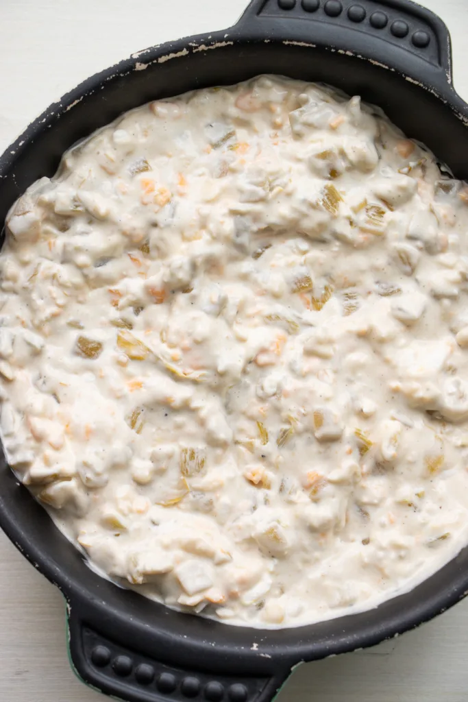 unbaked chile dip in a baking dish