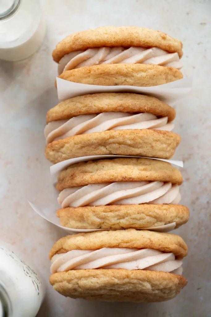 chewy snickerdoodle cookie sandwiches in a line 