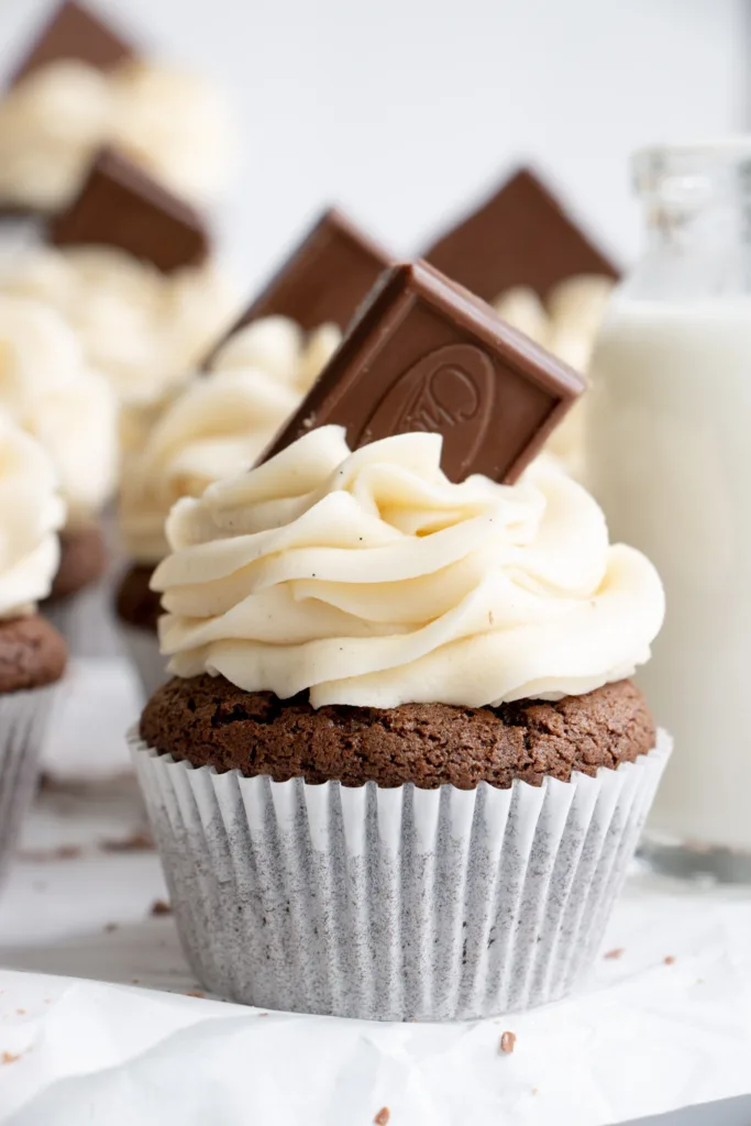 moist chocolate cupcake topped with vanilla frosting 