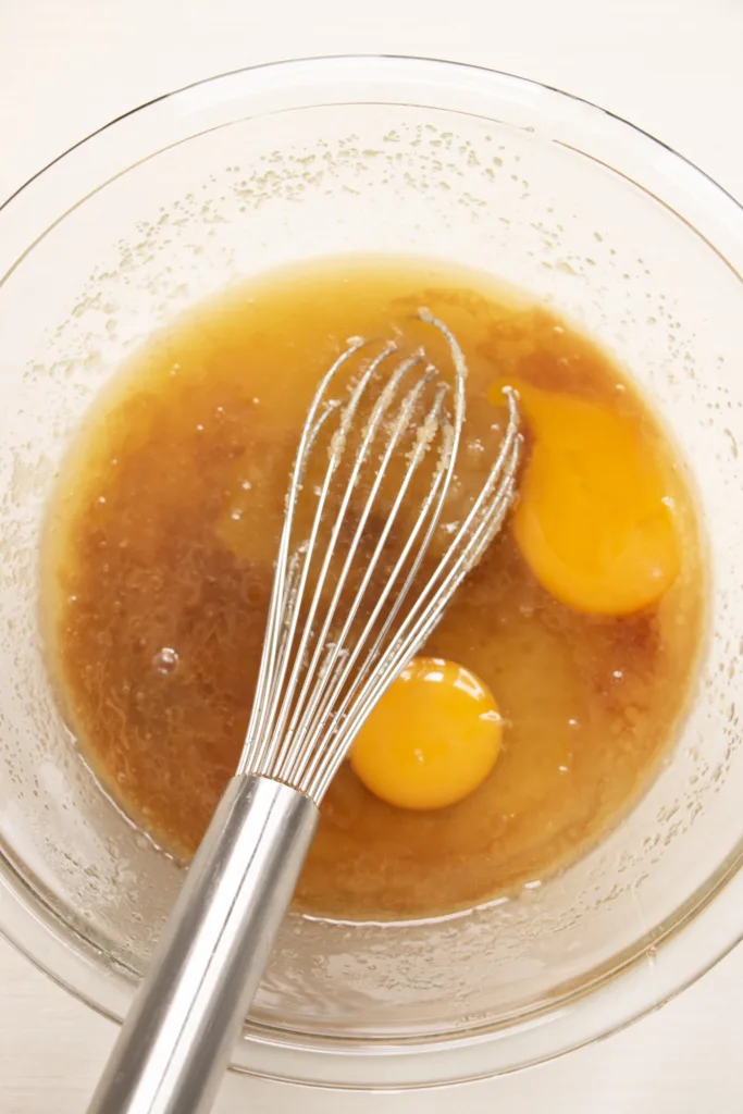 mixing bowl with sugar, butter, and eggs
