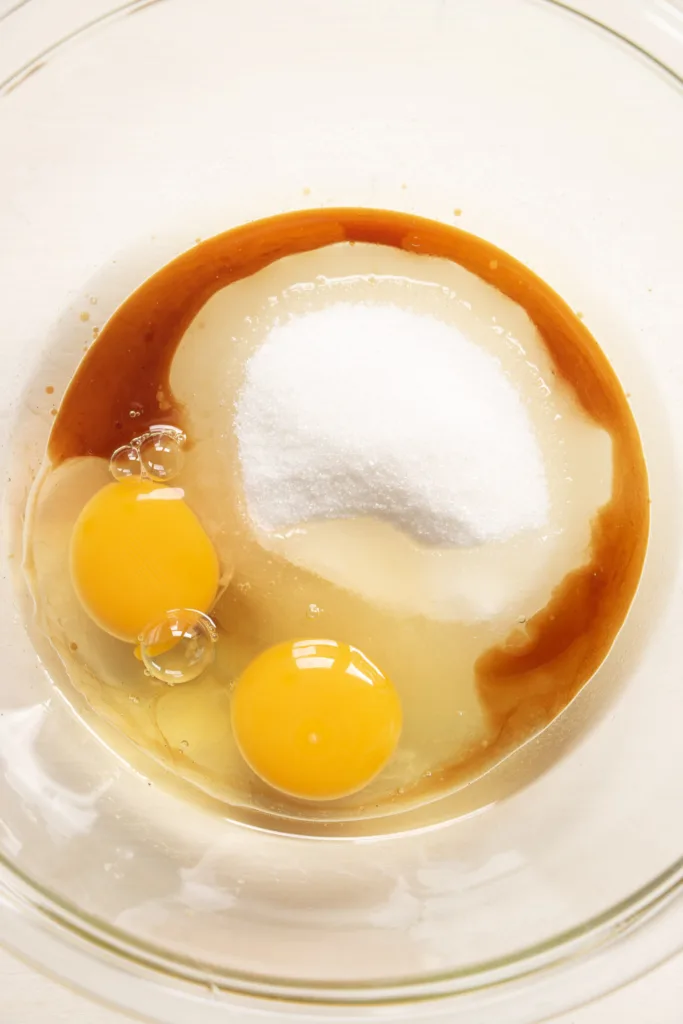 eggs, oil, sugar, and vanilla in a mixing bowl