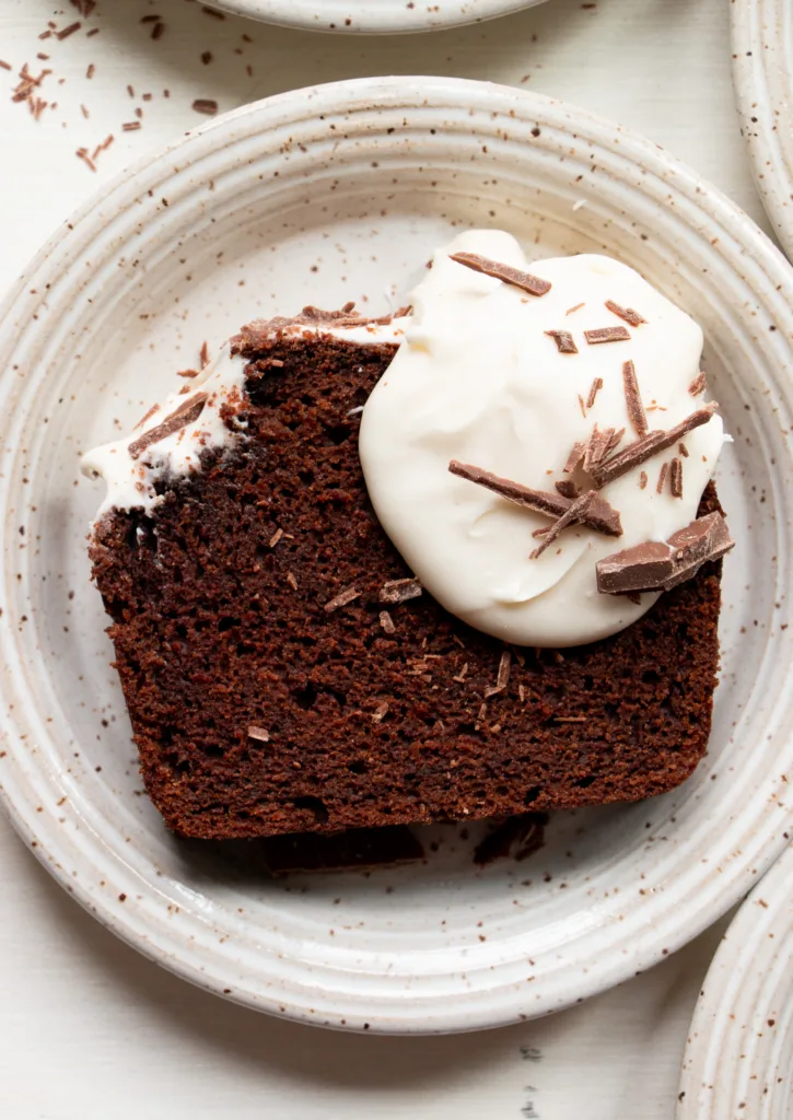 slice of decadent chocolate cake with cream cheese icing 