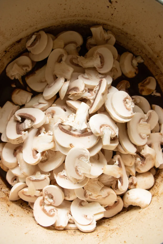 sliced mushrooms in large pot