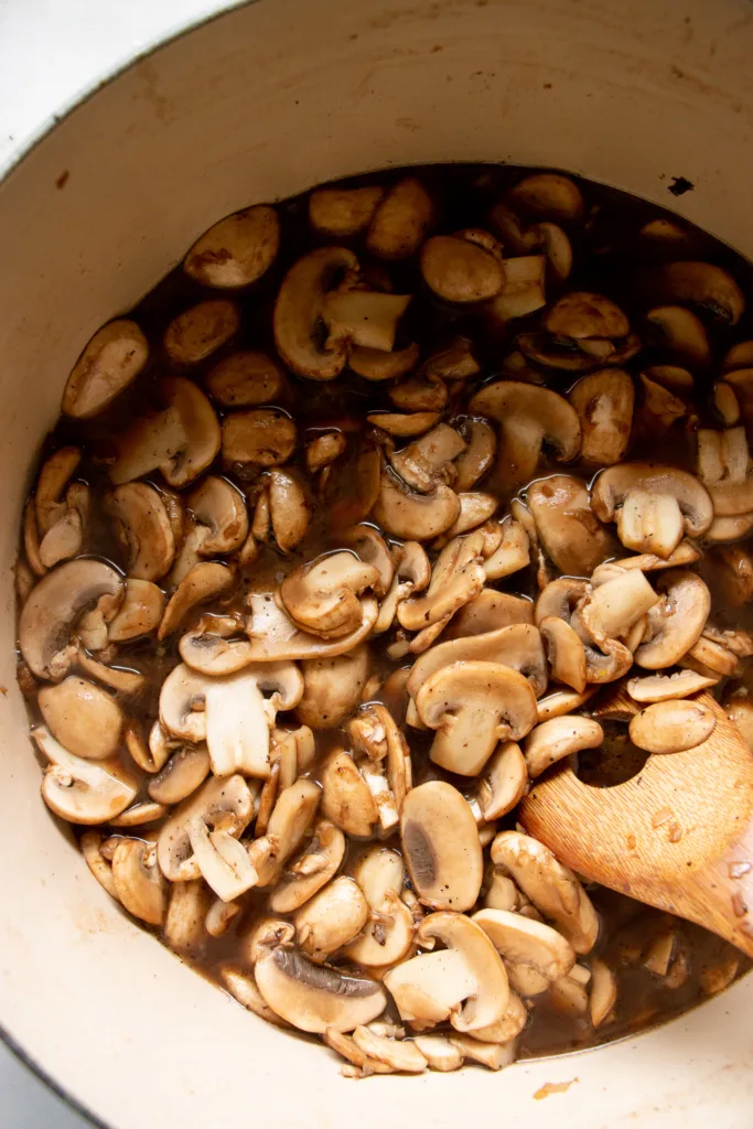 Dutch oven with sauteed mushrooms