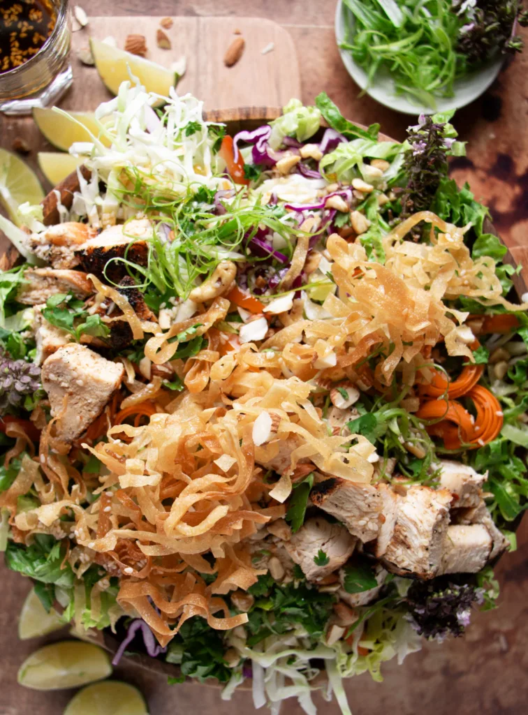 crispy wonton strips on top of Thai salad
