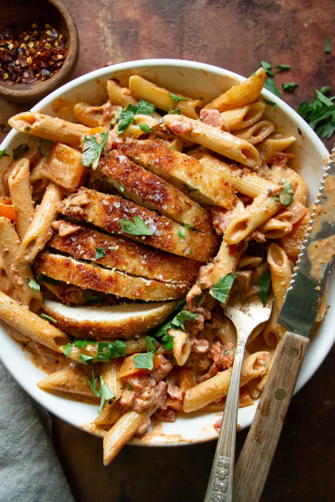 a bowl of smothered chicken pasta 