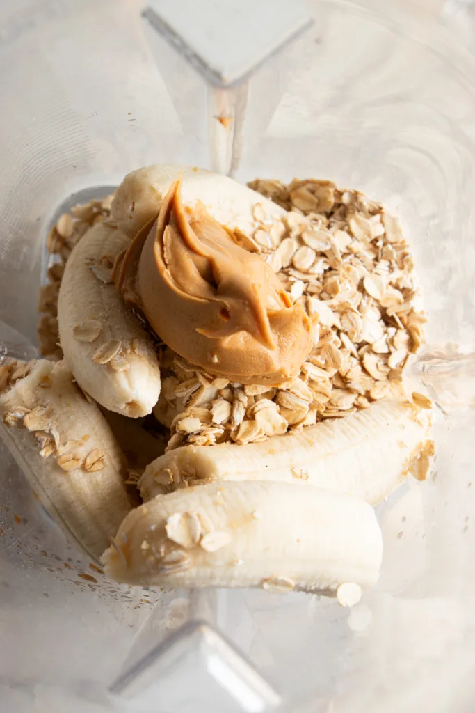 banana, oats, and peanut butter in a blender