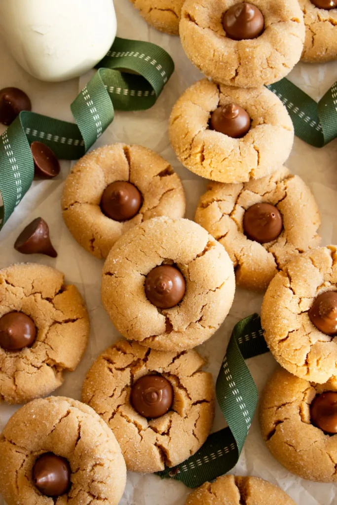 peanut butter blossom cookies on a sheet of parchment paper