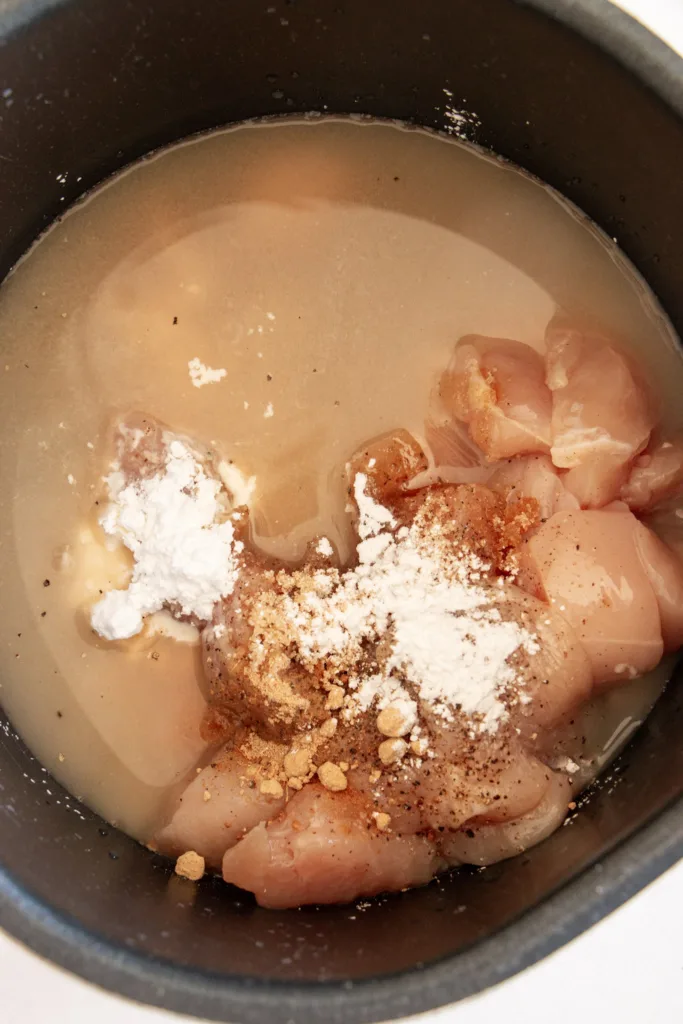 bourbon chicken ingredients combined in an instant pot 