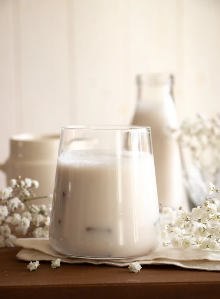 oat milk in a glass with milk