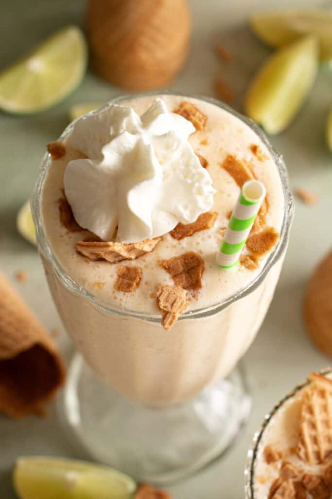 up close key lime pie milkshake with a paper straw