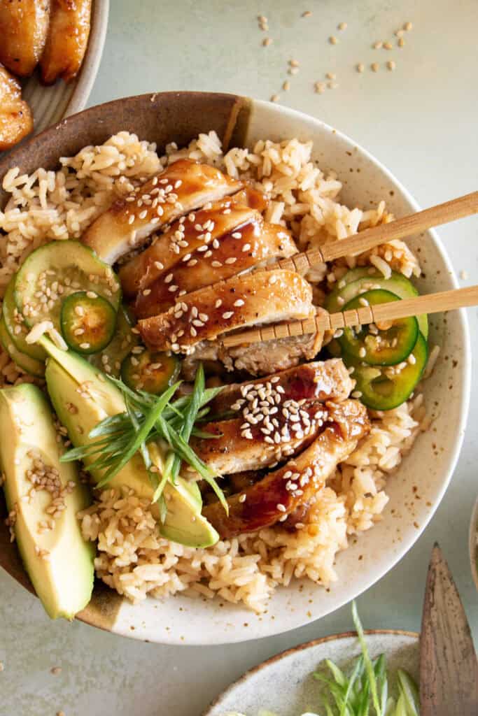 copycat teriyaki chicken being eaten with chopsticks 