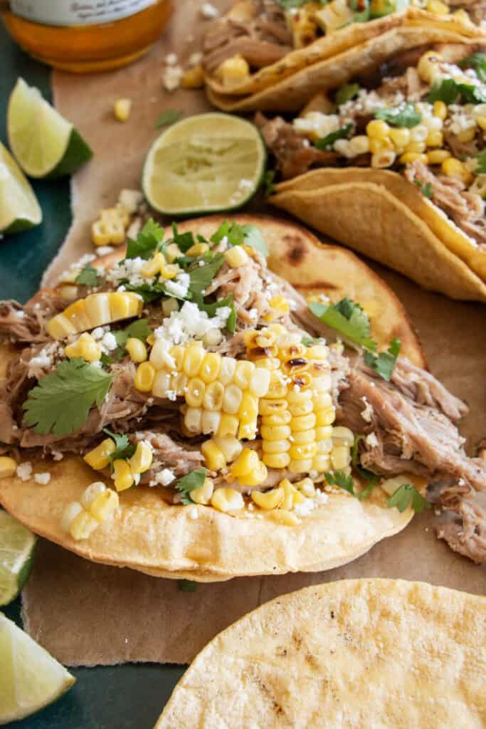 pork carnitas tacos with corn and cilantro