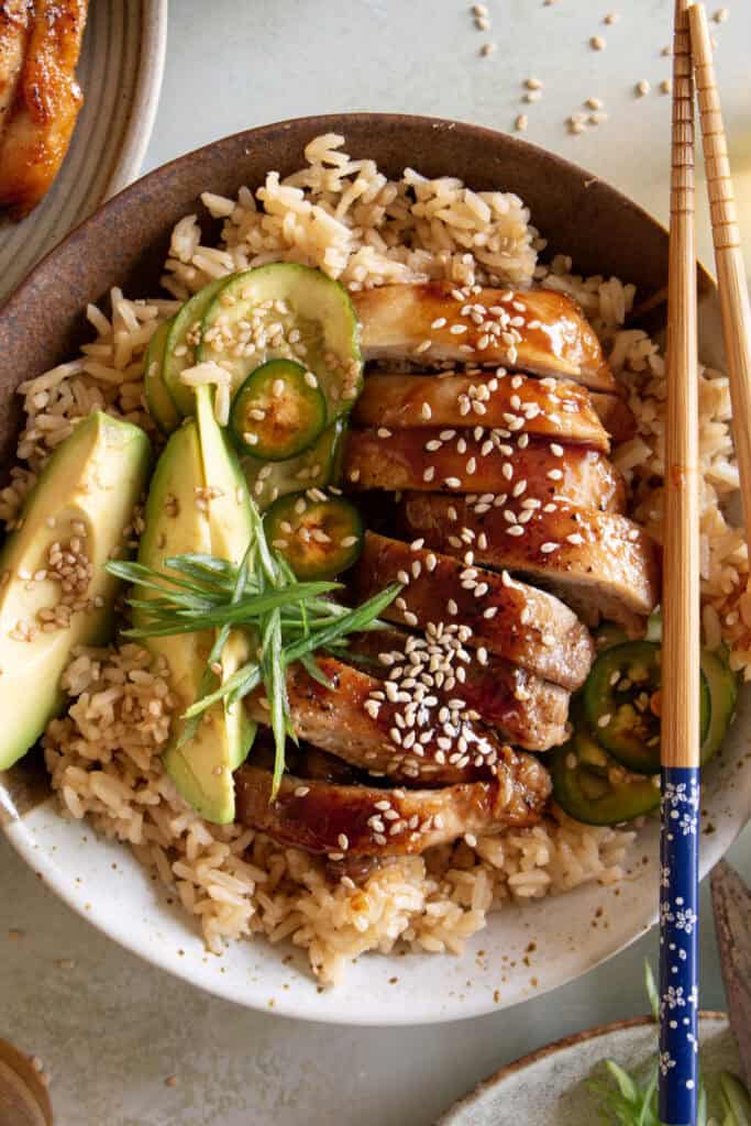 panda express teriyaki chicken over rice with avocado slices 