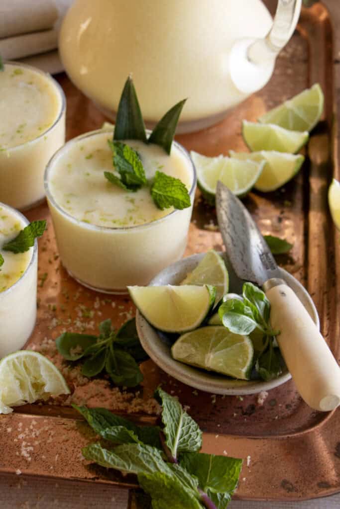 serving tray full of virgin pina coladas and garnishments 