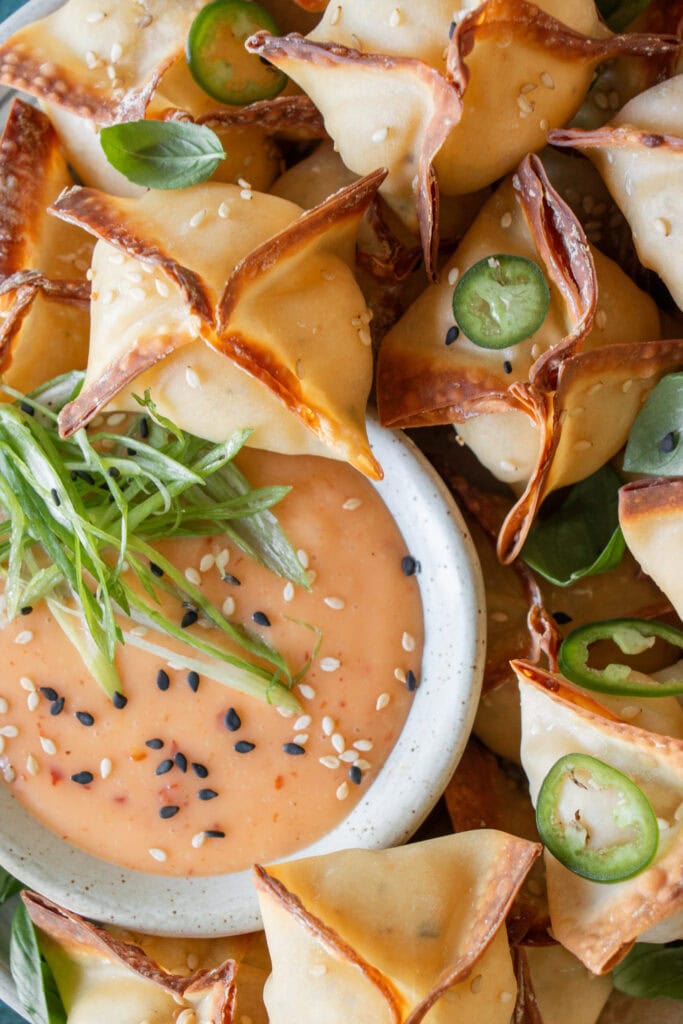 bowl of spicy chili sauce with cream cheese rangoons 