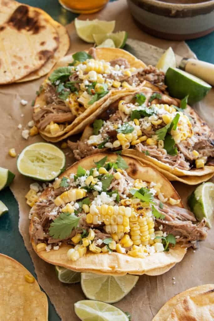 corn tortillas loaded with pork carnitas 