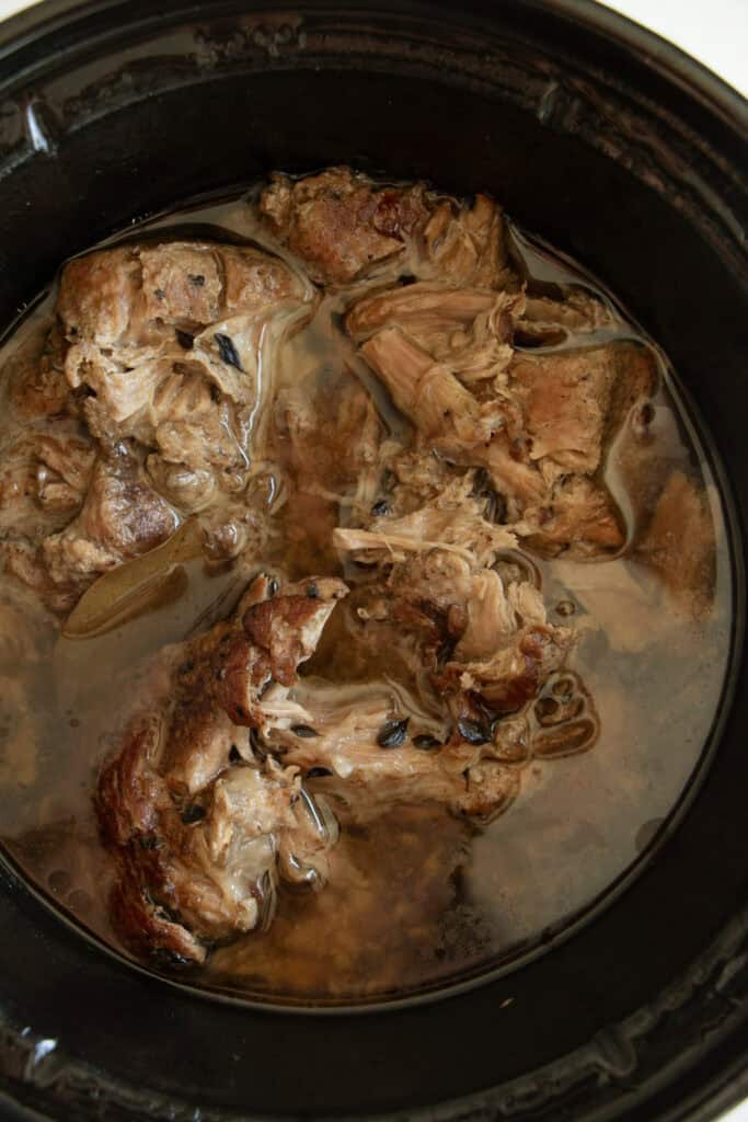 Cooked pork carnitas in the slow cooker