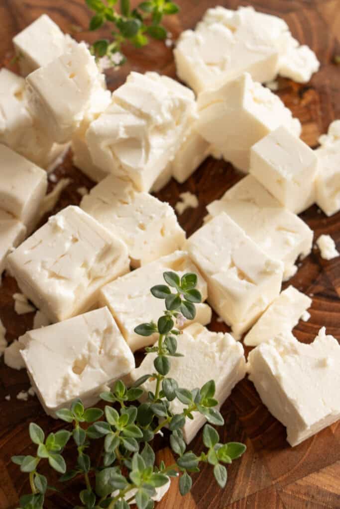 chunks of feat cheese on a cutting board