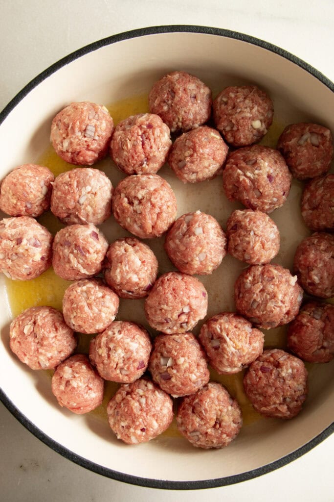 meatballs cooking in a skillet