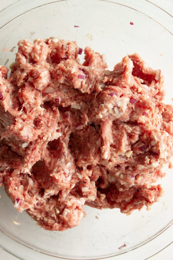 meatball mixture in a mixing bowl 