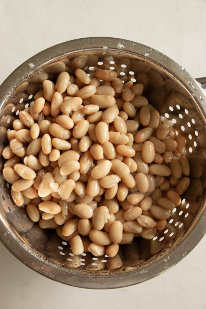 great northern beans in a colander 