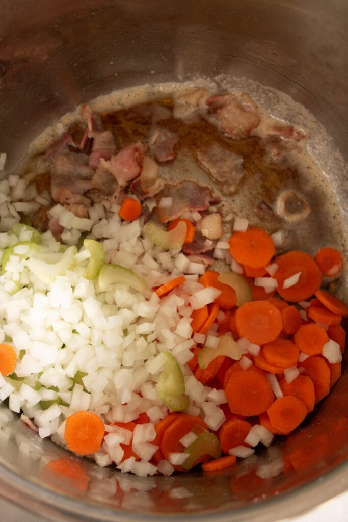 bacon and veggies sauteing in the base of an instant pot